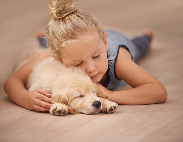 Baby resting with puppy | Baker Valley Floors